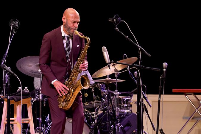 Closeup of Joshua Redman on stage with his quartet