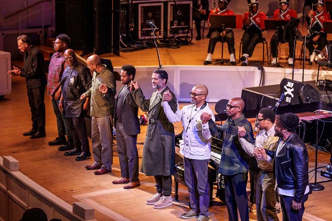 Wide bow shot of Jason Moran and fellow musicians on stage