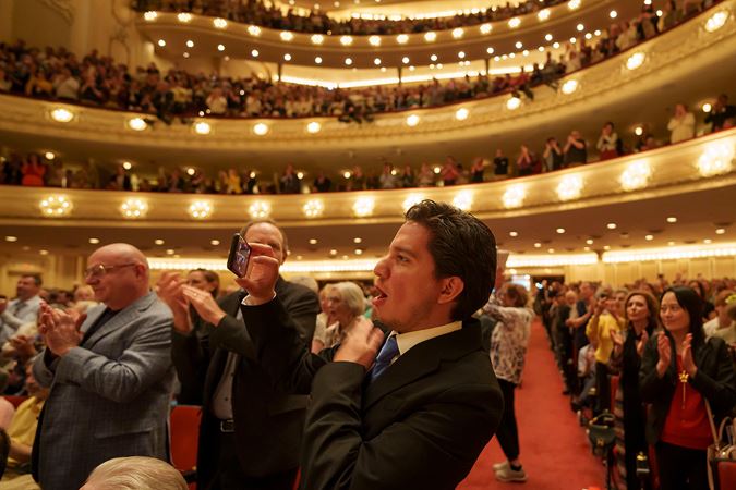 audience member recording with phone