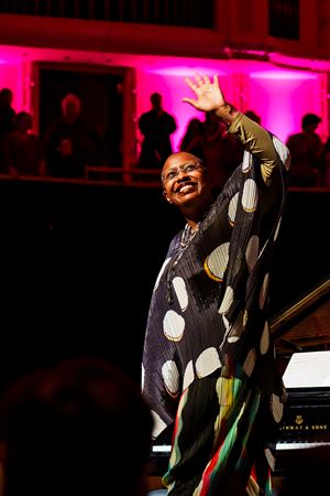 Cécile McLorin Salvant waves to the crowd as she exits the stage