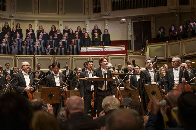 A bow shot of Zell Music Director Designate Klaus Mäkelä, the Chicago Symphony Orchestra and Chorus and Uniting Voices Chicago