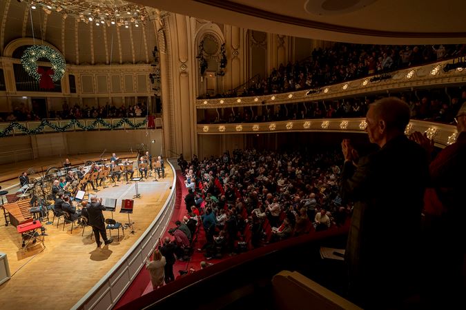 the audience gives a standing ovation to CSO principal trombone Jay Friedman