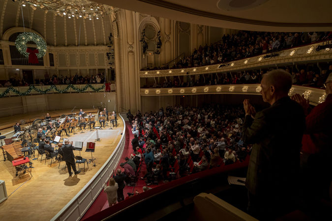 the audience gives a standing ovation to CSO principal trombone Jay Friedman