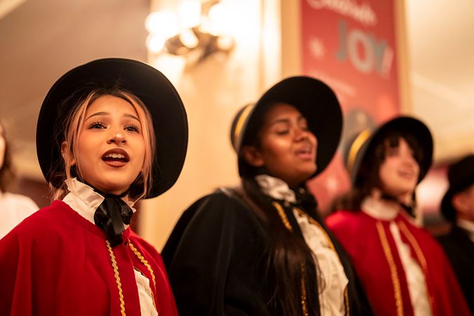 Close of up of a Leyden High School Chamber Singers member singing in the inner lobby during intermission