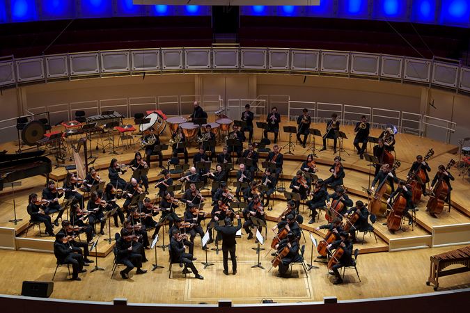 Wide shot of the Civic Orchestra and guest conductor Jerry Hot