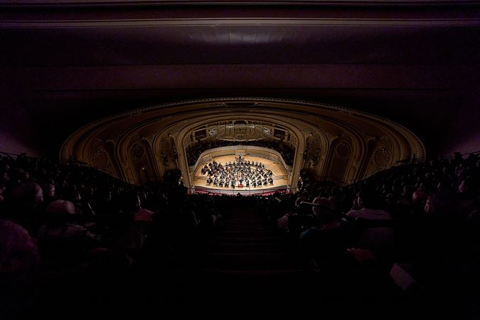 Wide shot of Berliner Philharmonker performing on stage