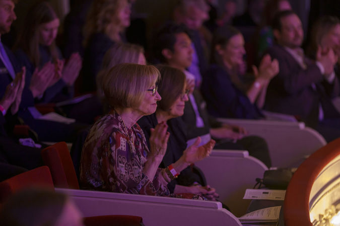 Audience members clapping from a Box