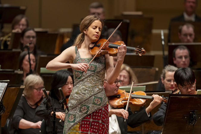Closeup of violinist Vilde Frang performing on stage