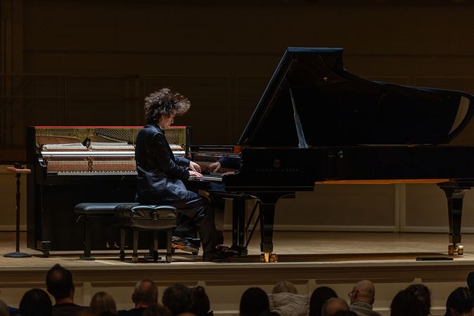 Hayato Sumino performs at the keyboard as his hair flies