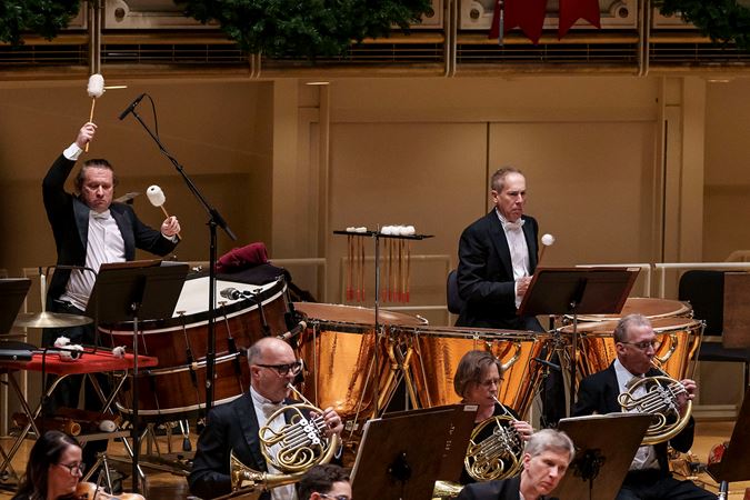 Principal Timpani David Herbert and Assistant Principal Timpani and Percussion Vadim Karpinos raise their mallets