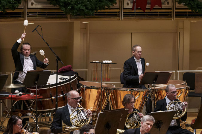 Principal Timpani David Herbert and Assistant Principal Timpani and Percussion Vadim Karpinos raise their mallets