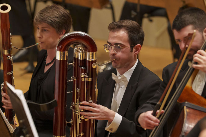 Closeup of a CSO musician playing the contrabasson
