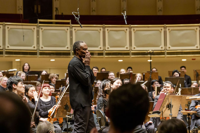 Thomas Wilkins Walking On Stage During A Standing Ovation