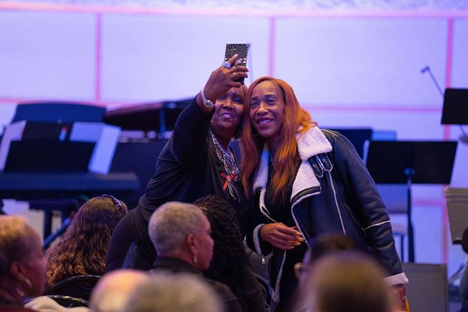 audience members taking selfie