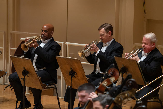 the trumpet section performs in the Bruckner symphony