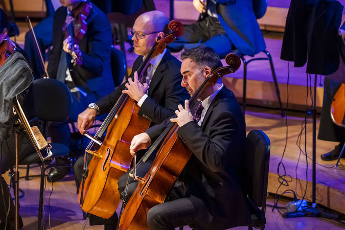 cellists playing