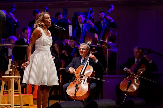 Closeup of Heather Headley singing on stage