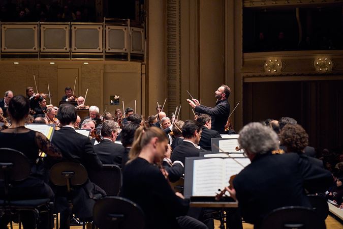 Closeup of Kirill Petrenko conducting Berliner Philharmoniker musicians