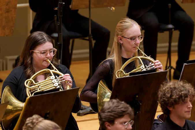 Closeup action shot of Civic horn players