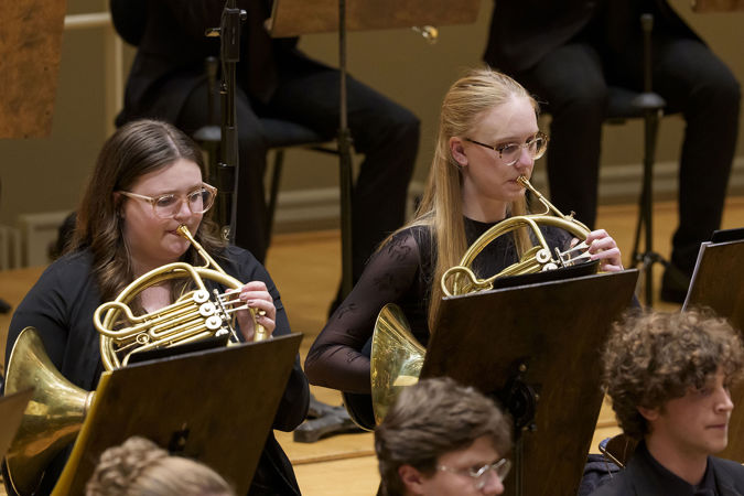 Closeup action shot of Civic horn players