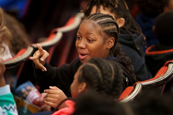 A young audience member chatting with friends on the Main Floor before the CSO for Kids concert