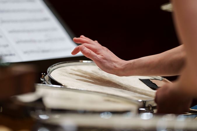 Yeh's hand striking drum