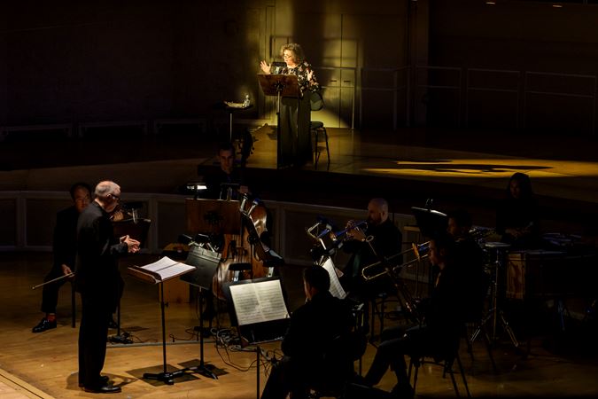 Wide shot of the CSO and an actor (narrator) from The Goodman presenting The Soldier's Tale