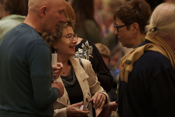 Patrons chatting before the concert on the main floor