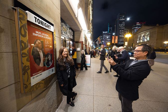 woman poses outside venue