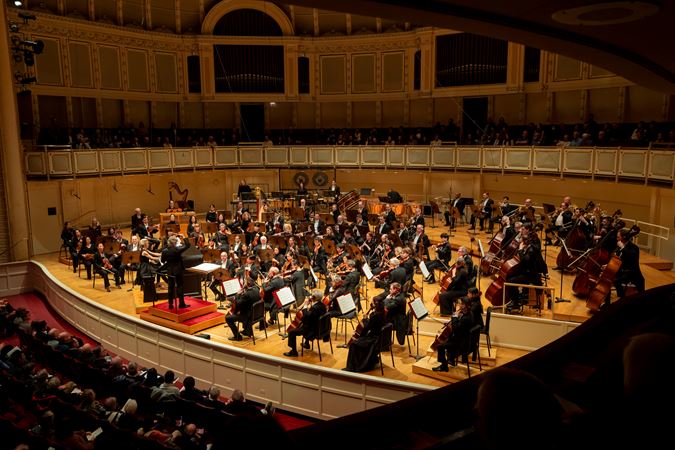A side wide shot of the CSO, Esa-Pekka Salonen and Iveta Apkalna