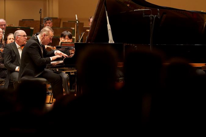 Simon Trpčeski focuses at the keyboard during a difficult passage of Rachmaninov's First Piano Concerto
