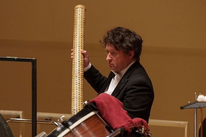 percussionist playing rainstick