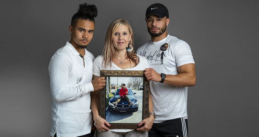 Christina Johnson poses with her sons Aaron and Calen