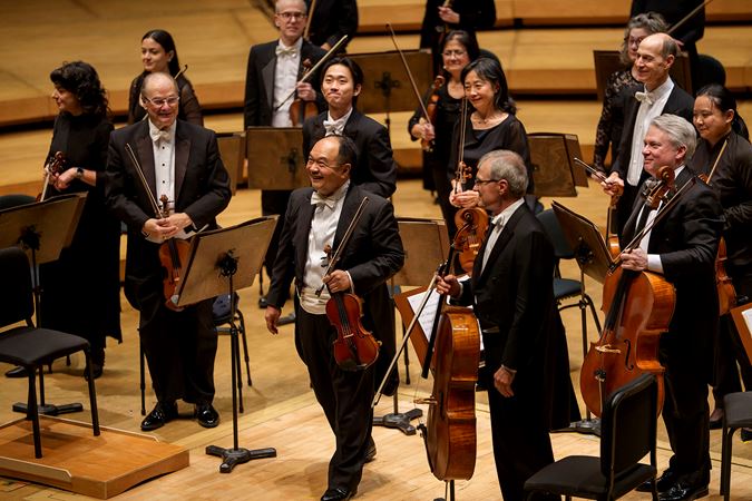 Robert Chen and the Orchestra bow together after performing Mozart's Divertimento in B-flat Major