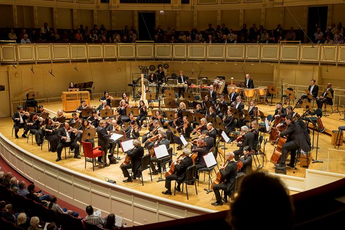 Wide shot of the Chicago Symphony Orchestra and conductor Mikko Franck