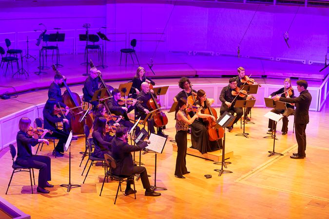 Nicholas Koo conducts a 16-member string ensemble in Jimmy López's Guardian of the Horizon