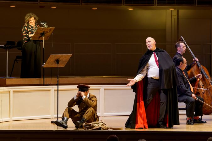 Closeup action shot of actors (the soldier, the devil and the narrator) from The Goodman performing The Soldier's Tale on stage with the CSO