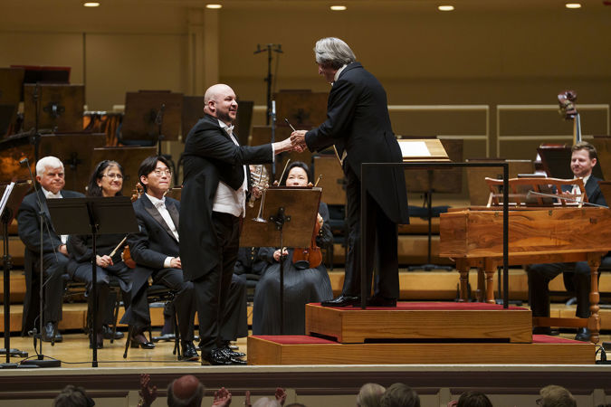 CSO principal trumpet Esteban Batallán shakes hands with Riccardo Muti on stage after his CSO debut