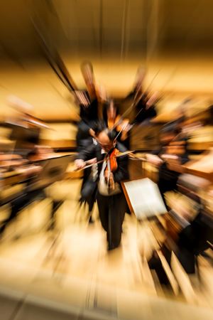 a fish eye effect shot of Robert Chen playing a solo on violin