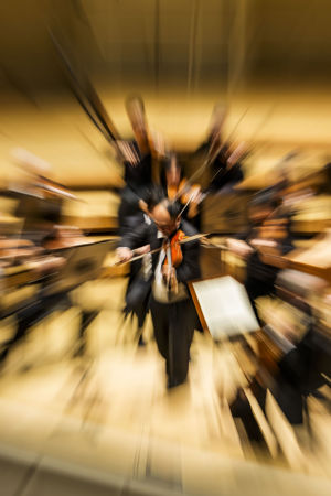 a fish eye effect shot of Robert Chen playing a solo on violin