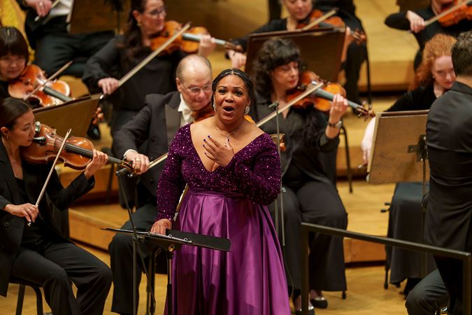 Janai Brugger raises a hand to her chest in heartfelt emotion as she sings selections by Florence Price