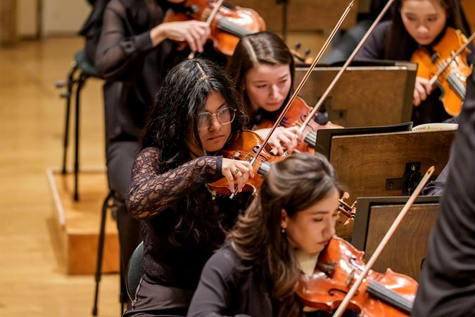 Closeup action shot of a Civic violinist