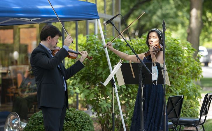 Violin Simon Michal and viola Weijing Wang perform at the Breakers.