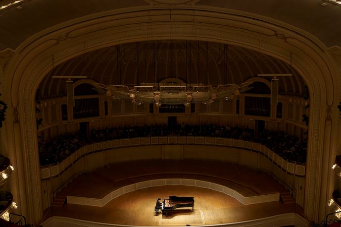 Wide shot of Mao Fujita playing the piano