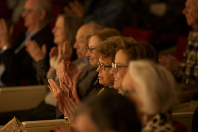 Audience members clapping after the conclusion of the Civic's first concert of the season at Symphony Center