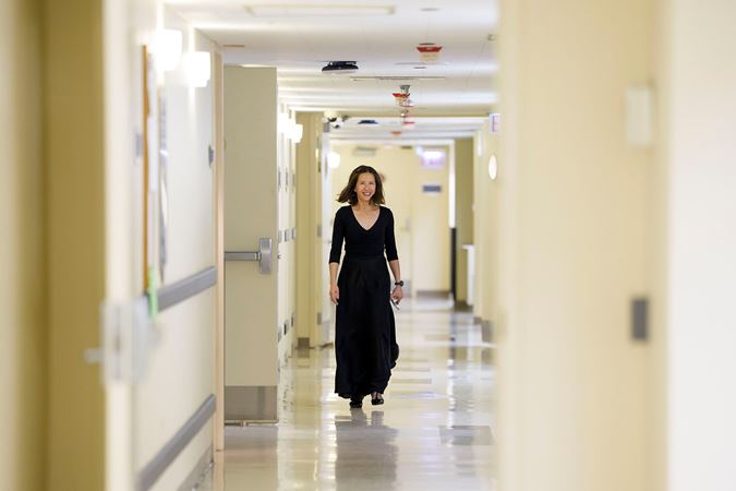CSO principal percussion Cynthia Yeh smiling and walking backstage ahead of the concert