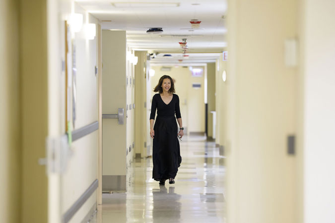 CSO principal percussion Cynthia Yeh smiling and walking backstage ahead of the concert