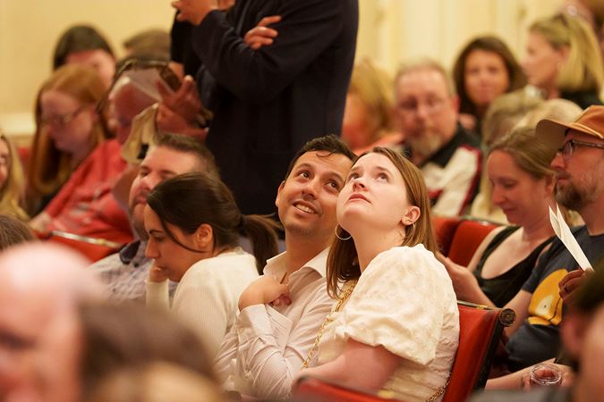 A young couple looks around Orchestra Hall from their seats on the Main Floor