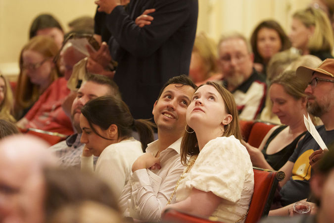 A young couple looks around Orchestra Hall from their seats on the Main Floor