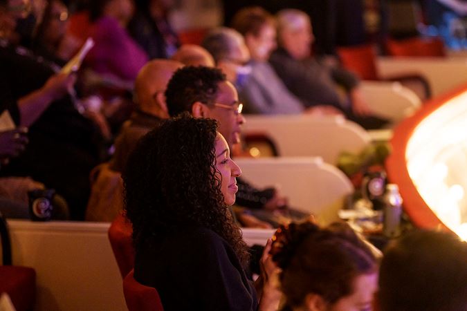 Sideview of patrons enjoying the concert from the box level
